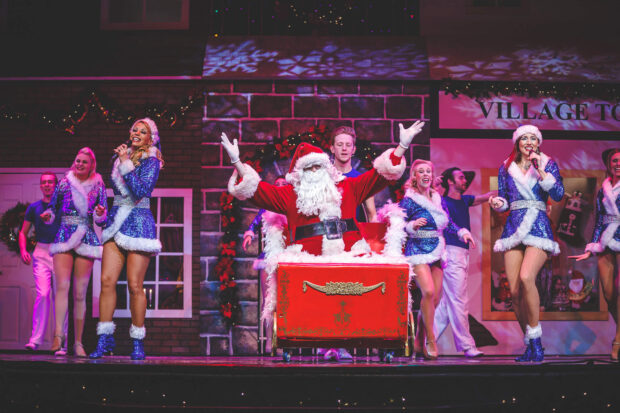 Santa and dancers on stage during a Branson Christmas show