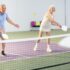 Seniors playing Branson pickleball indoors