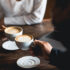 people holding coffee cups at coffee houses in Branson